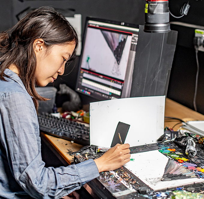 Renee Zhan working in animation studio