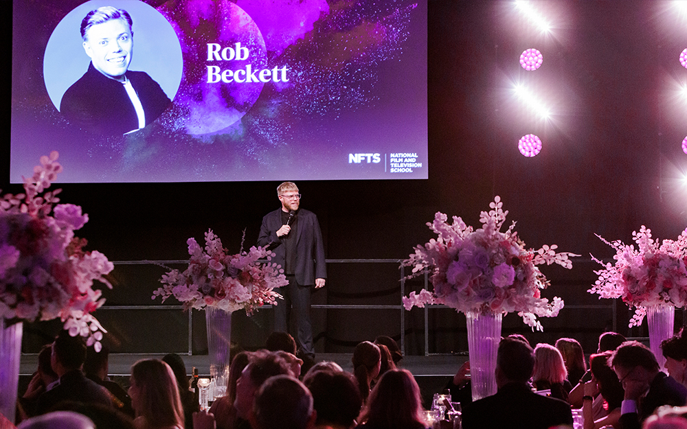 Rob Beckett entertaining guests on stage