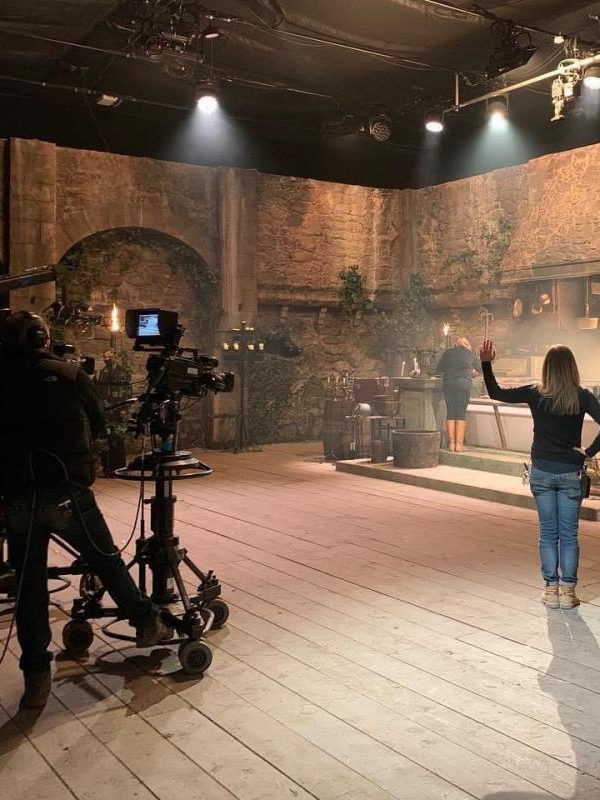 set inside a castle with production crew