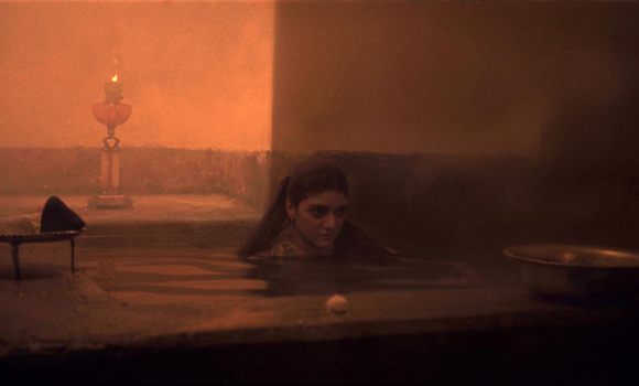 Still from Chess of the Wind showing girl in water